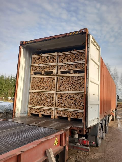 Aisle of firewood crates drying in our warehouse